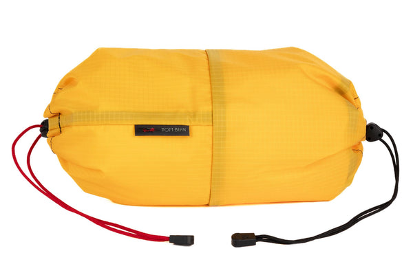 An Aeronaut 30 Travel Laundry Stuff Sack in Marigold Cerylon.